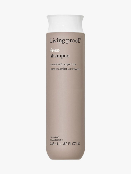 Living Proof No Frizz Shampoo greige bottle of shampoo with white cap on light gray background